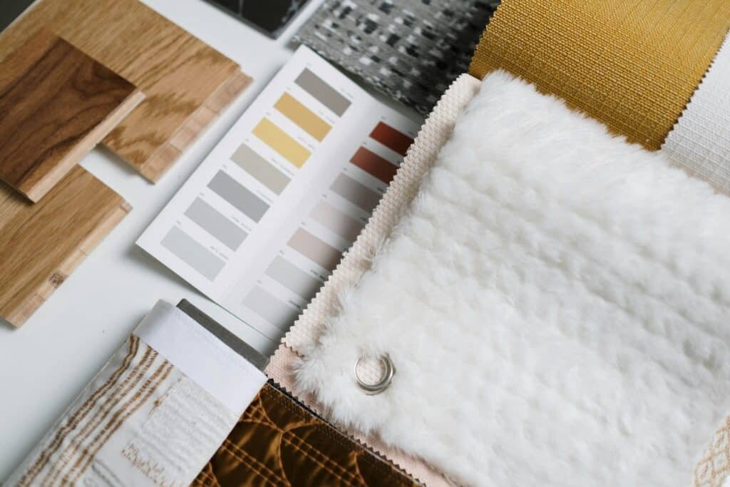 A flat lay of color swatches and fabric samples ideal for interior design inspiration.